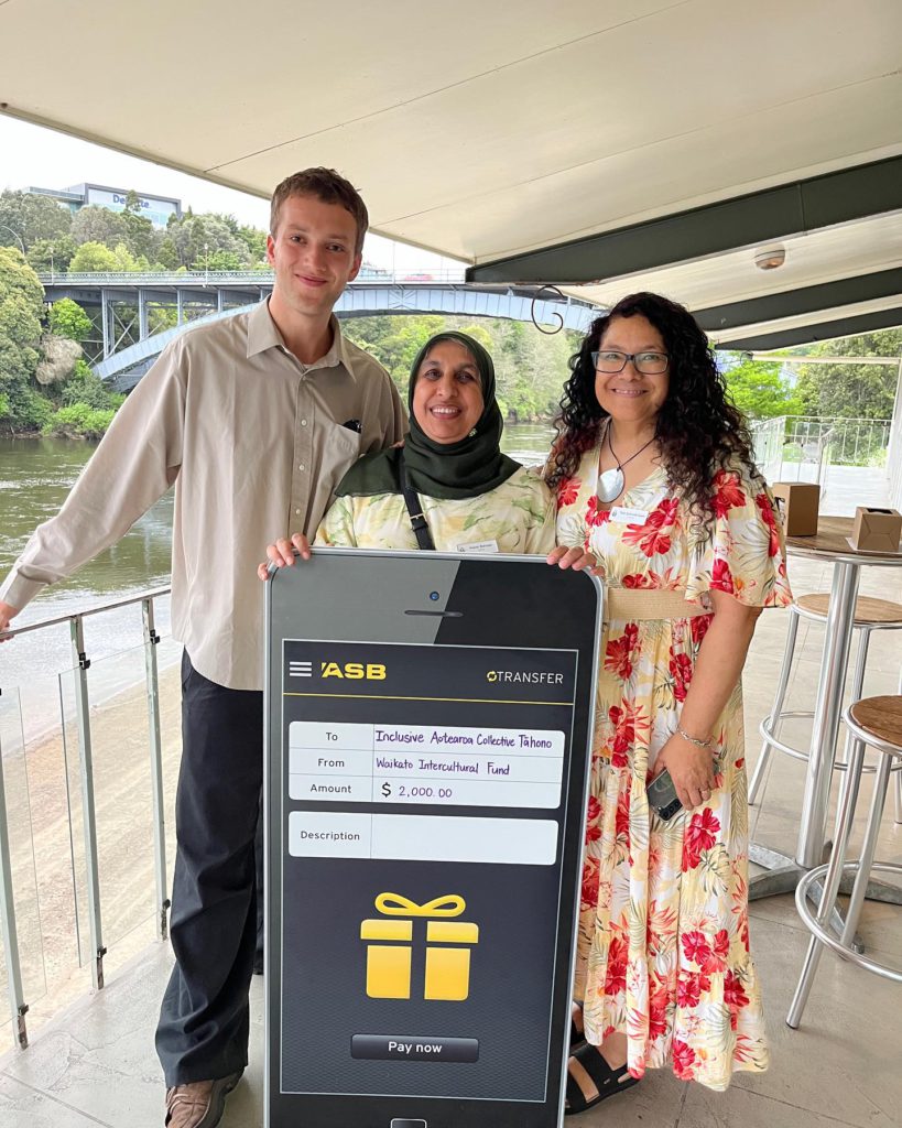 A photo of Staughm, Anjum and Lautalie receiving the grant from MOCA