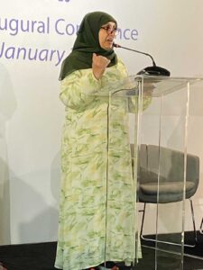 A photo of Anjum presenting at the conference
